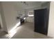 View of the white kitchen with stainless steel appliances at 3102 W Leroy St # A, Tampa, FL 33607