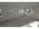 Bright living room with white walls and floor. Lots of light and windows at 3102 W Leroy St # A, Tampa, FL 33607