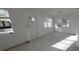 Bright living room featuring natural light through multiple windows and a front door at 3102 W Leroy St # A, Tampa, FL 33607