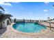 Resort-style pool with dolphin statues and water views at 429 Saint Andrews Dr, Belleair, FL 33756