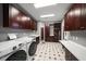 Laundry room with ample storage and modern appliances at 429 Saint Andrews Dr, Belleair, FL 33756