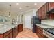 Modern kitchen with granite countertops and stainless steel appliances at 8817 Crystal Creek Ct, Land O Lakes, FL 34638