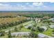 Aerial view of community with lush landscaping and spacious homes at 1333 Shady Pine Way # D, Tarpon Springs, FL 34688