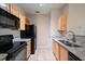 Kitchen with granite countertops and black appliances at 5000 Culbreath Key Way # 1-203, Tampa, FL 33611