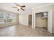 Bedroom with tile floors, ceiling fan, and laundry closet at 5000 Culbreath Key Way # 1-203, Tampa, FL 33611