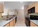 Kitchen with granite countertops and black appliances at 5000 Culbreath Key Way # 1-203, Tampa, FL 33611