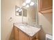 Bathroom features granite countertop and a vanity with mirror at 5000 Culbreath Key Way # 1-203, Tampa, FL 33611