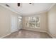Bedroom with tile floors, ceiling fan and sliding door to balcony at 5000 Culbreath Key Way # 1-203, Tampa, FL 33611