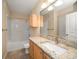 Bathroom boasts granite countertop, large mirror, and a bathtub at 5000 Culbreath Key Way # 1-203, Tampa, FL 33611
