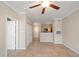 Living room with tile floors and ceiling fan at 5000 Culbreath Key Way # 1-203, Tampa, FL 33611