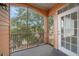 Private screened balcony overlooks lush trees and landscape at 5000 Culbreath Key Way # 1-203, Tampa, FL 33611