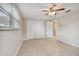 Bedroom with tile floors, ceiling fan, and closet at 3525 Umber Rd, Holiday, FL 34691