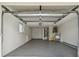 Spacious garage with overhead storage and utility area at 3525 Umber Rd, Holiday, FL 34691