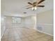 Bright dining area with tile floors and ceiling fan at 3525 Umber Rd, Holiday, FL 34691