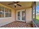 Bright screened porch with tile floor and backyard view at 3525 Umber Rd, Holiday, FL 34691