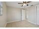 Spacious bedroom with ceiling fan and tile flooring at 3525 Umber Rd, Holiday, FL 34691