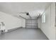 Spacious garage with gray floor and utility sink at 3525 Umber Rd, Holiday, FL 34691
