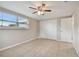 Bedroom with tile floors, ceiling fan, and closet at 3525 Umber Rd, Holiday, FL 34691