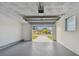 Attached garage with open door showing driveway at 3525 Umber Rd, Holiday, FL 34691