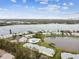 Aerial view of waterfront community with pool, lake, and boat access at 3825 Pompano Se Dr, St Petersburg, FL 33705