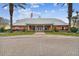 Community clubhouse with welcoming front entrance and landscaping at 3825 Pompano Se Dr, St Petersburg, FL 33705
