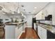 Modern kitchen with stainless steel appliances and white cabinetry at 3825 Pompano Se Dr, St Petersburg, FL 33705
