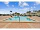 Refreshing community pool surrounded by a brick patio at 3825 Pompano Se Dr, St Petersburg, FL 33705