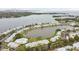 Aerial view of community with pool and waterfront access at 3825 Pompano Se Dr, St Petersburg, FL 33705
