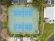 Overhead view of two well-maintained tennis courts at 3825 Pompano Se Dr, St Petersburg, FL 33705