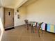 Inviting patio space featuring comfortable seating and outdoor decor with a tan door at 7520 Sunshine Skyway S Ln # 210, St Petersburg, FL 33711