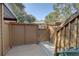 Back patio access with gate and wooden deck at 1106 Lennox W Rd, Palm Harbor, FL 34683