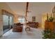Living room with access to balcony and view of trees at 1106 Lennox W Rd, Palm Harbor, FL 34683