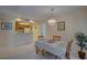 Dining room with chandelier and kitchen access at 1106 Lennox W Rd, Palm Harbor, FL 34683