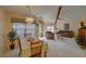 Dining area with table, chairs, and chandelier at 1106 Lennox W Rd, Palm Harbor, FL 34683