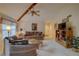 Living room with two sofas, coffee table, and wood shelving at 1106 Lennox W Rd, Palm Harbor, FL 34683