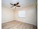 Bright bedroom with light wood flooring and ceiling fan at 101 Lake Ne Ave # 211, Largo, FL 33771