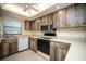 Kitchen with wood cabinets, stainless steel appliances, and light countertops at 101 Lake Ne Ave # 211, Largo, FL 33771