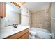 Clean bathroom with tub, shower, vanity, and tile flooring at 101 Lake Ne Ave # 211, Largo, FL 33771