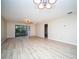 Spacious living room with light flooring and sliding doors to balcony at 101 Lake Ne Ave # 211, Largo, FL 33771