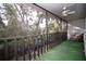 Screened balcony overlooking lush trees and landscaping at 101 Lake Ne Ave # 211, Largo, FL 33771