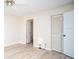 Bedroom with laminate flooring, ceiling fan, and access to bathroom at 101 Lake Ne Ave # 211, Largo, FL 33771