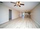 Open living room with laminate flooring and ceiling fan at 101 Lake Ne Ave # 211, Largo, FL 33771