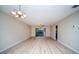 Spacious living room with light flooring and sliding doors to balcony at 101 Lake Ne Ave # 211, Largo, FL 33771