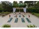Outdoor yoga deck with a pergola and lush landscaping at 36750 Us Highway 19 N # 09110, Palm Harbor, FL 34684