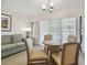 Cozy living room with sofa, round table, and access to balcony at 36750 Us Highway 19 N # 09110, Palm Harbor, FL 34684
