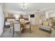 Open living area with dining table, sofa, and twin beds at 36750 Us Highway 19 N # 09110, Palm Harbor, FL 34684