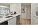 Modern kitchen with stainless steel dishwasher and white cabinets at 36750 Us Highway 19 N # 09110, Palm Harbor, FL 34684