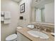 Clean bathroom with granite countertop and a large mirror at 36750 Us Highway 19 N # 09110, Palm Harbor, FL 34684