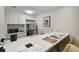 Well-equipped kitchenette with stainless steel appliances and breakfast bar at 36750 Us Highway 19 N # 09110, Palm Harbor, FL 34684