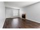 Bright living room featuring a fireplace and laminate flooring at 14323 Hanging Moss Cir # 102, Tampa, FL 33613